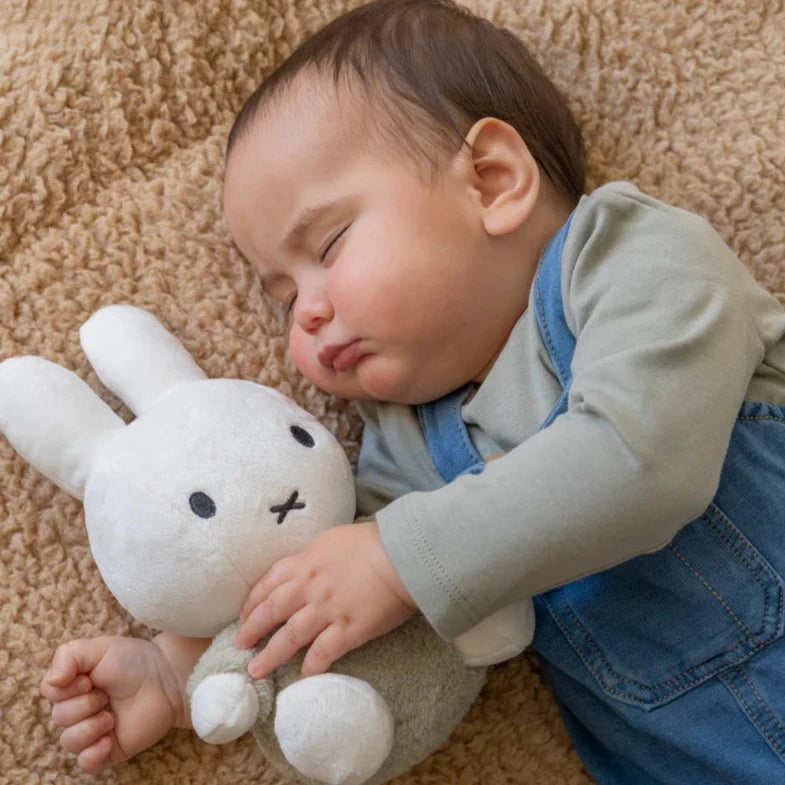 White Miffy soft toy with green fluffy outfit