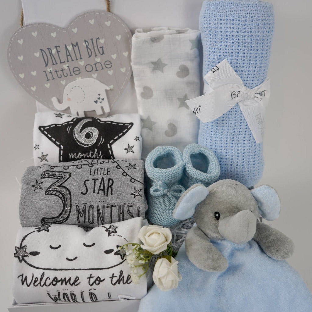 baby boy hamper box includes baby milestone vests, dream big plaque, muslin, cellular blanket, grey and blue elephant comforter, blue baby boy booties