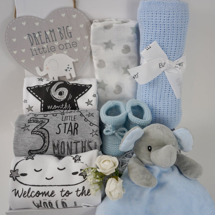 baby boy hamper box includes baby milestone vests, dream big plaque, muslin, cellular blanket, grey and blue elephant comforter, blue baby boy booties