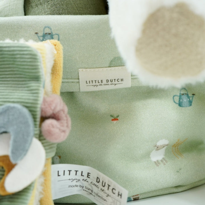 Little dutch farm basket in pale green, green little dutch blanket and farm green and plae green baby muslin, Harry and Rose organic baby lotion, Farm animals pram book in green, Lamb comforter and lamb soft toy