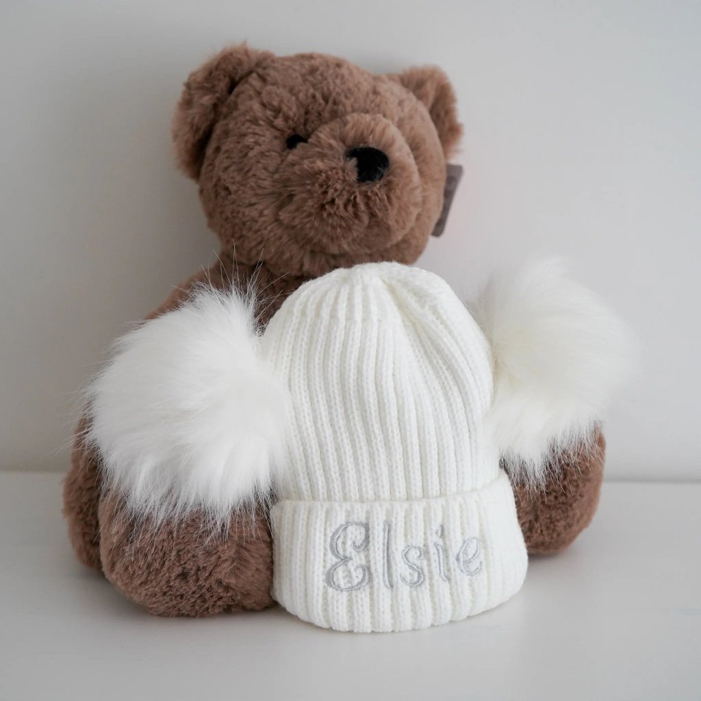 white baby knitfluffy  pom pom hat with name embroidered 