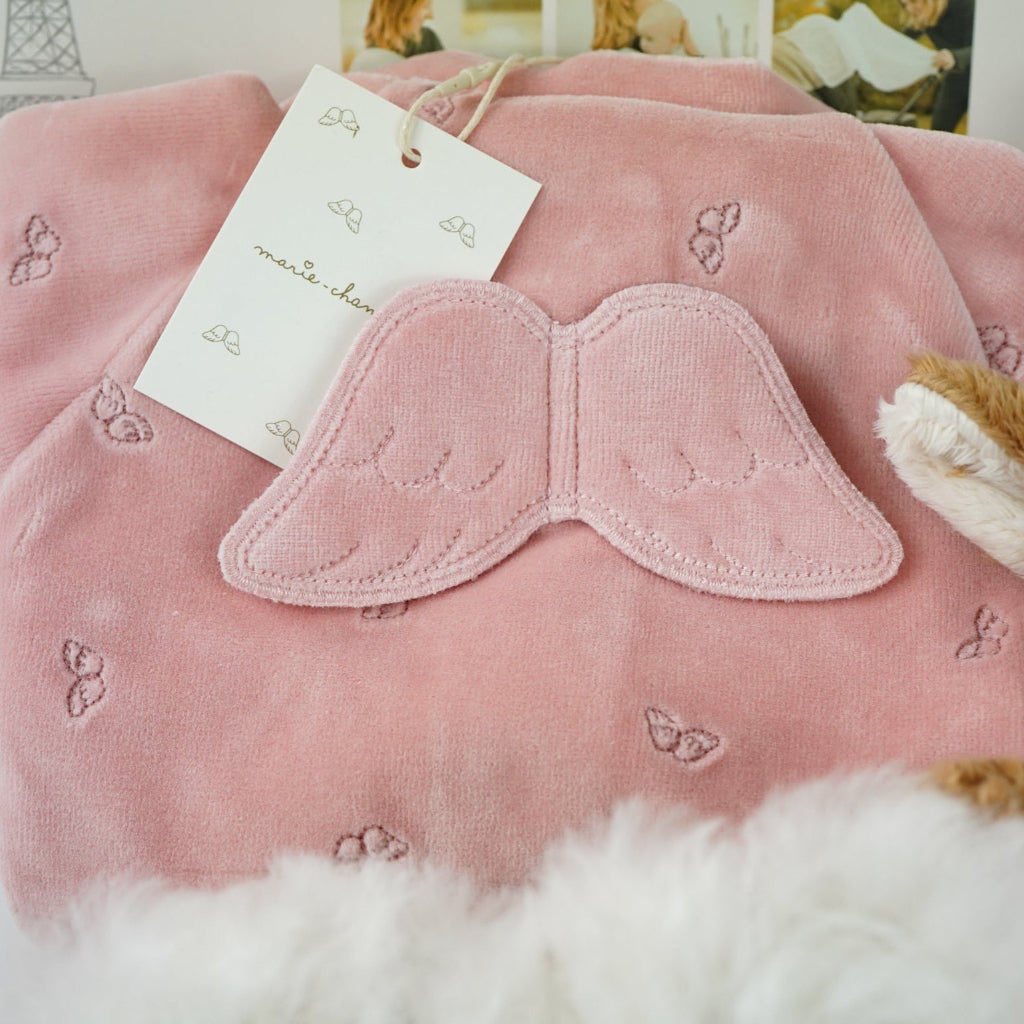 uxury mum and baby hamper, luxury pink velour sleepsuit with gold angel wings embroidery, pink star knit blanket, soft pink deer comforter,  ivory alpaca baby slippers, 4 sophie la giraffe muslins, box of chocolate domes, mum to mum tips book