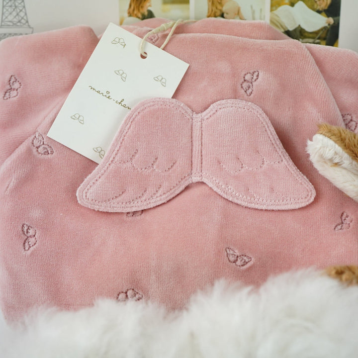 uxury mum and baby hamper, luxury pink velour sleepsuit with gold angel wings embroidery, pink star knit blanket, soft pink deer comforter,  ivory alpaca baby slippers, 4 sophie la giraffe muslins, box of chocolate domes, mum to mum tips book