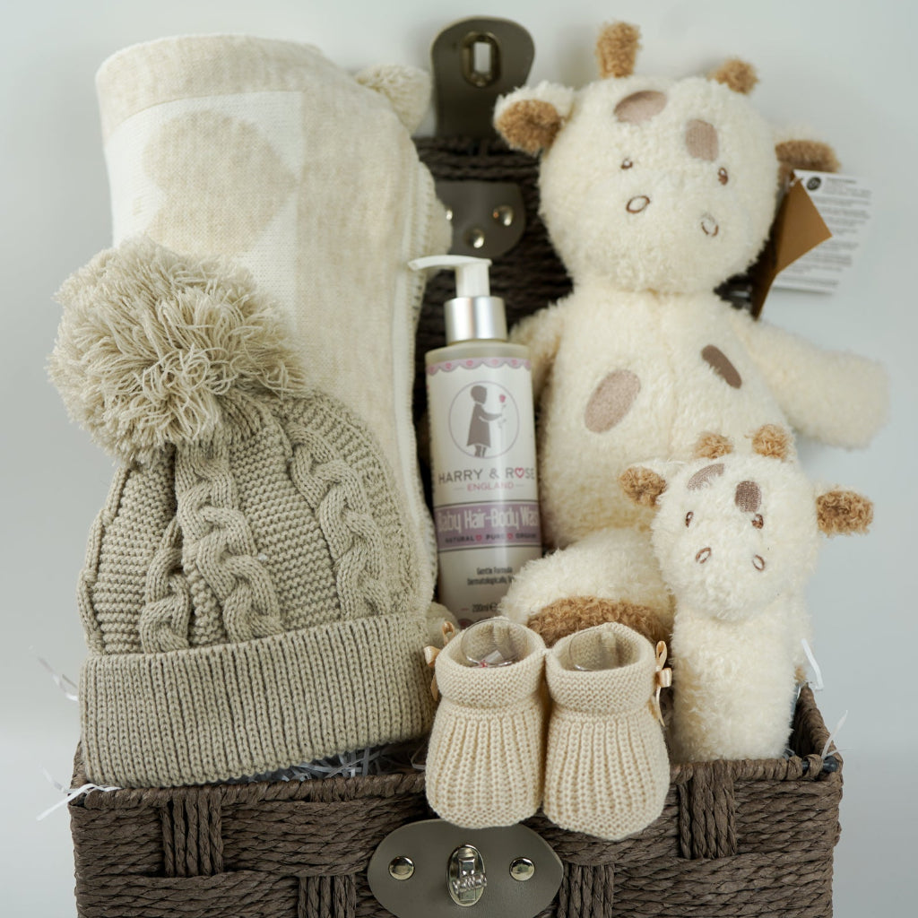 NEUTRAL BABY HAMPER, BABY BLANKET WITH HEARTS AND POMPOMS, BABY WASH, NATTOU GIRAFFE , GRAFFE RATTLE, BABY BOOTIES 