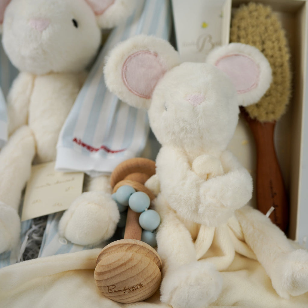 luxury baby gift hamper, luxury striped baby romper with embroidery on the cuffs, luxury pear wood hair brush, White mouse soft toy and matching comforter , wooden rattle