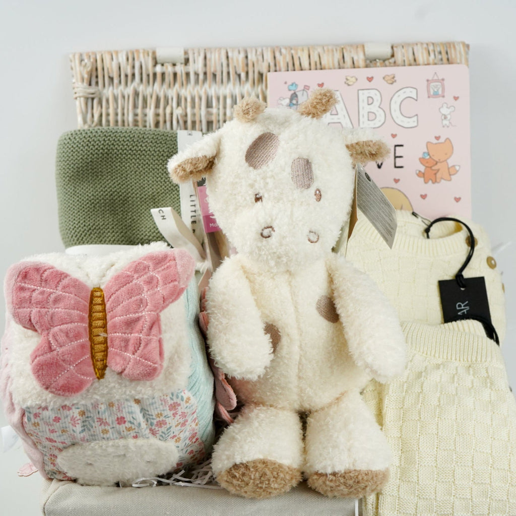 baby gifl hamper with soft cuddly teddy fleece giraffe soft toy, check cream organic cotton baby knit set, sage baby soft organic blanket, soft baby girl activity cube with miffy rabbit, ABC of Love baby board book