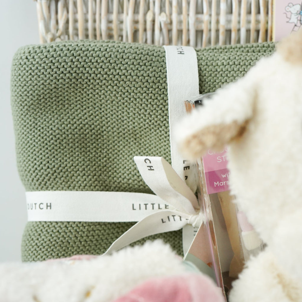 baby gifl hamper with soft cuddly teddy fleece giraffe soft toy, check cream organic cotton baby knit set, sage baby soft organic blanket, soft baby girl activity cube with miffy rabbit, ABC of Love baby board book