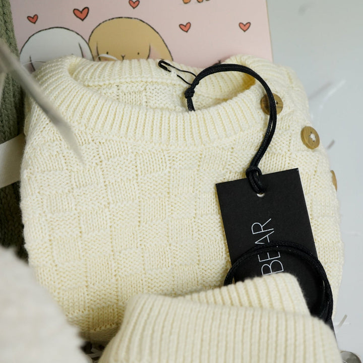 baby gifl hamper with soft cuddly teddy fleece giraffe soft toy, check cream organic cotton baby knit set, sage baby soft organic blanket, soft baby girl activity cube with miffy rabbit, ABC of Love baby board book