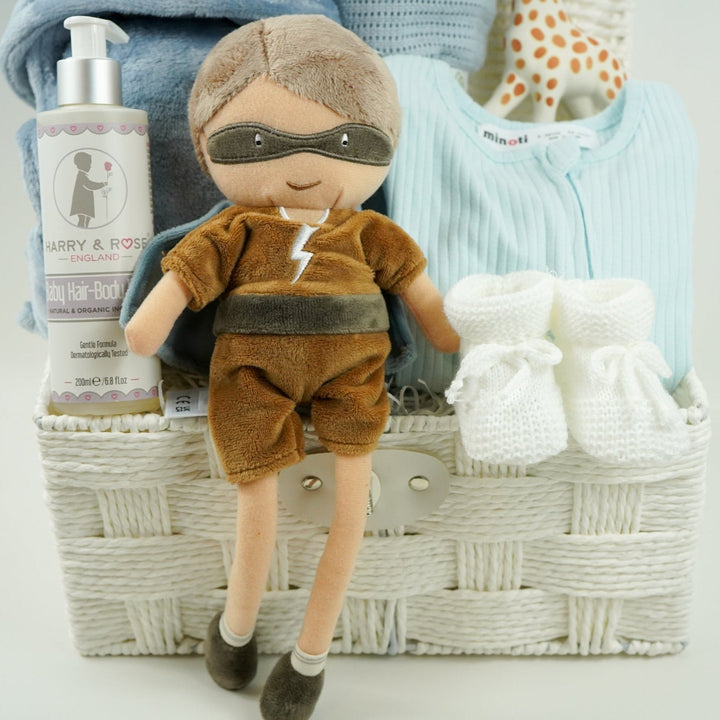 aby gift basket with plush toy, clothing, and baby products including sleepsuit, toiletries, Sophie la giraffe, botties , baby dressing gown in dusty blue