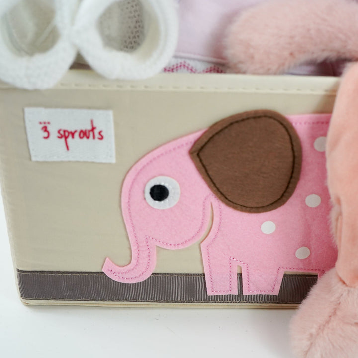 nappy caddy baby hamper gift with baby dressing gown white with cute ears, baby white hooded towel with pink/white edging, baby girl clothing set, pink pig soft toy with green headband and matching comforter, white baby booties, pink cellular blanket