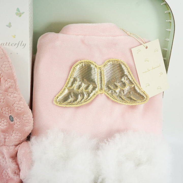 luxury baby girl gift, pink velour sleepsuit with gold angel wings by Marie-Chantal, alpaca white baby slippers, Organic baby toiletries  and pink miffy comforter 