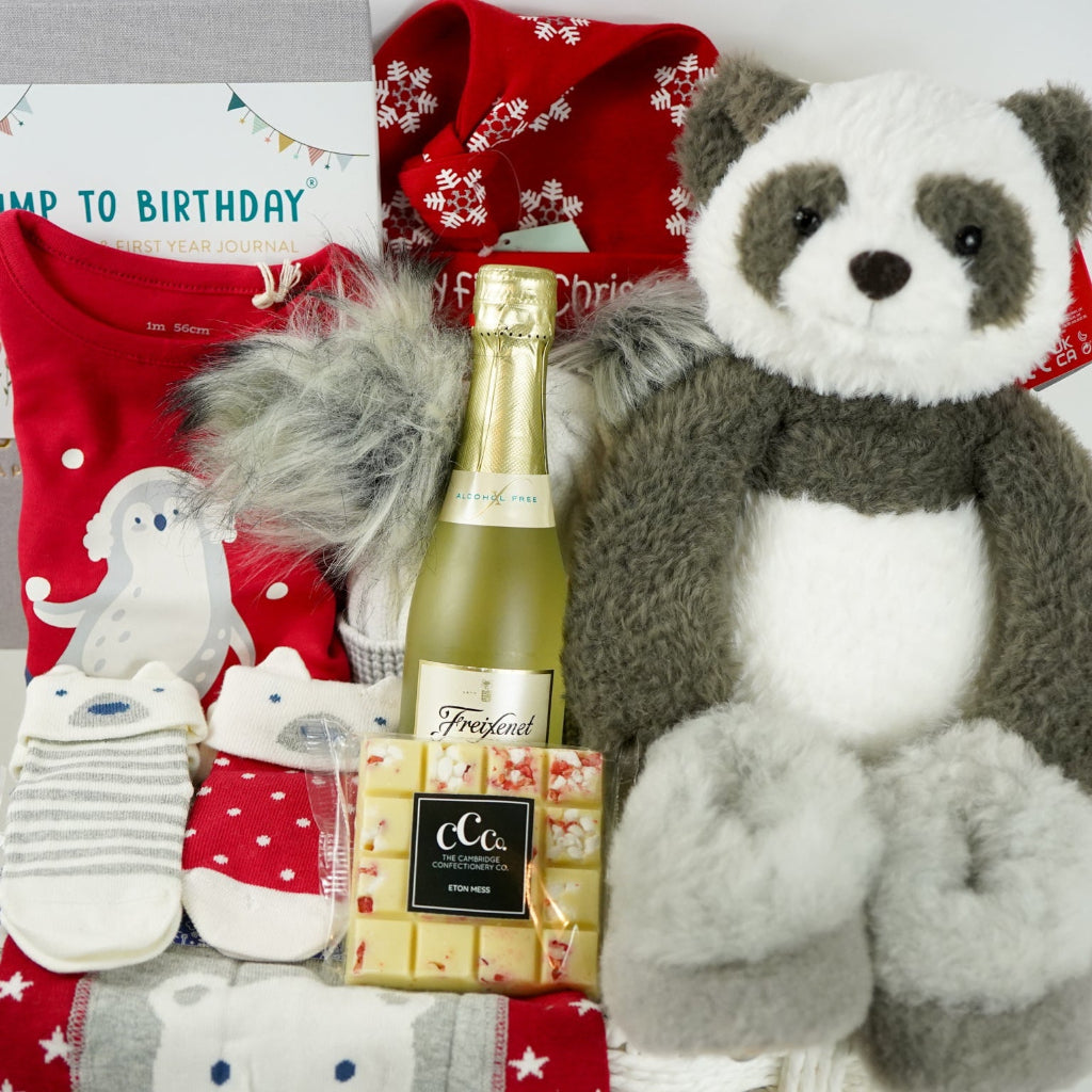 uxury baby hamper , my first Christmas, baby Christmas outfit, baby journal, black and white panda soft toy, white chocolate square,  nnsecco, fluffy hat, alpaca baby slippers 