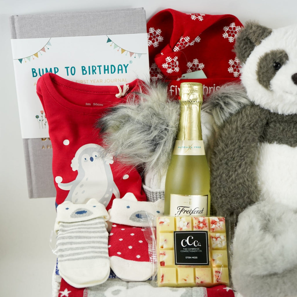uxury baby hamper , my first Christmas, baby Christmas outfit, baby journal, black and white panda soft toy, white chocolate square,  nnsecco, fluffy hat, alpaca baby slippers 