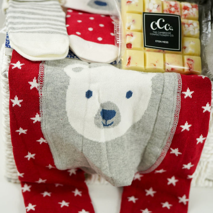 uxury baby hamper , my first Christmas, baby Christmas outfit, baby journal, black and white panda soft toy, white chocolate square,  nnsecco, fluffy hat, alpaca baby slippers 