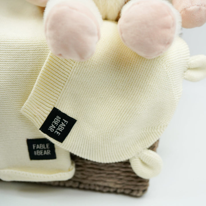 uxury baby gifts in grey hamper basket  organic baby baby clothing set, soft cow and matching rattle and comforter, muslin swaddles, baby organic booties