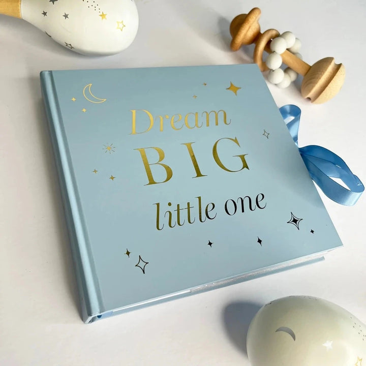 Dream big photo album for a baby, blue cover with gold writing and blue ribbon tie