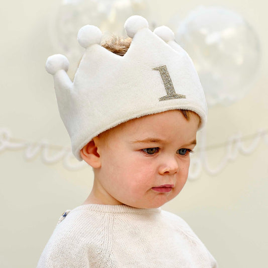 white fabric first birthday crown  with white pom poms 