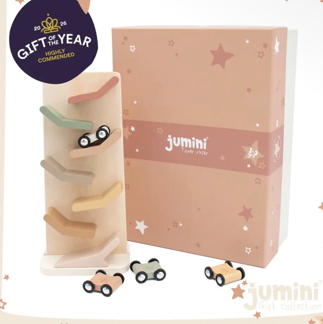 Jumini Wooden Race gift set featuring a wooden race track tower with small wooden toy cars, shown next to its decorated pink and beige box on a white background with a 'Gift of the Year' badge.