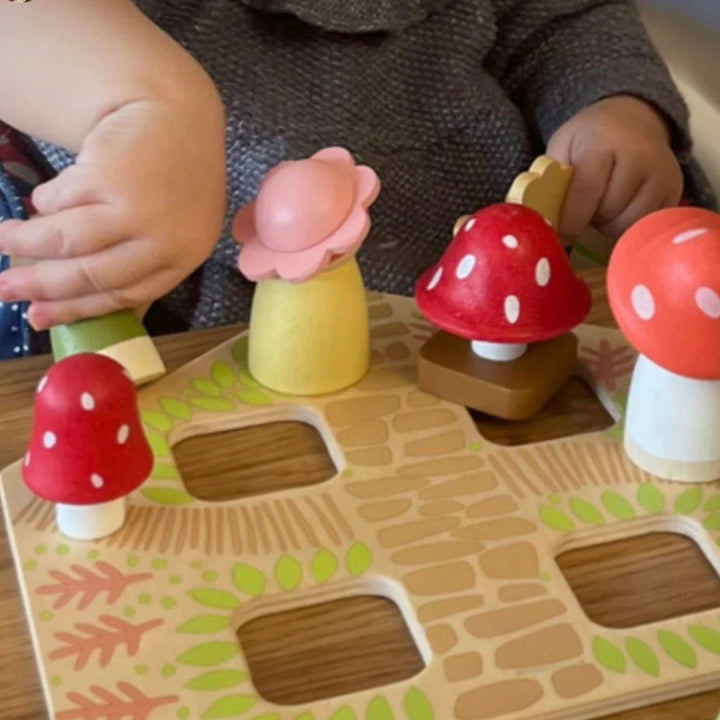 wooden dolls house with pink roof and carry handle, wooden dolls and flowers 