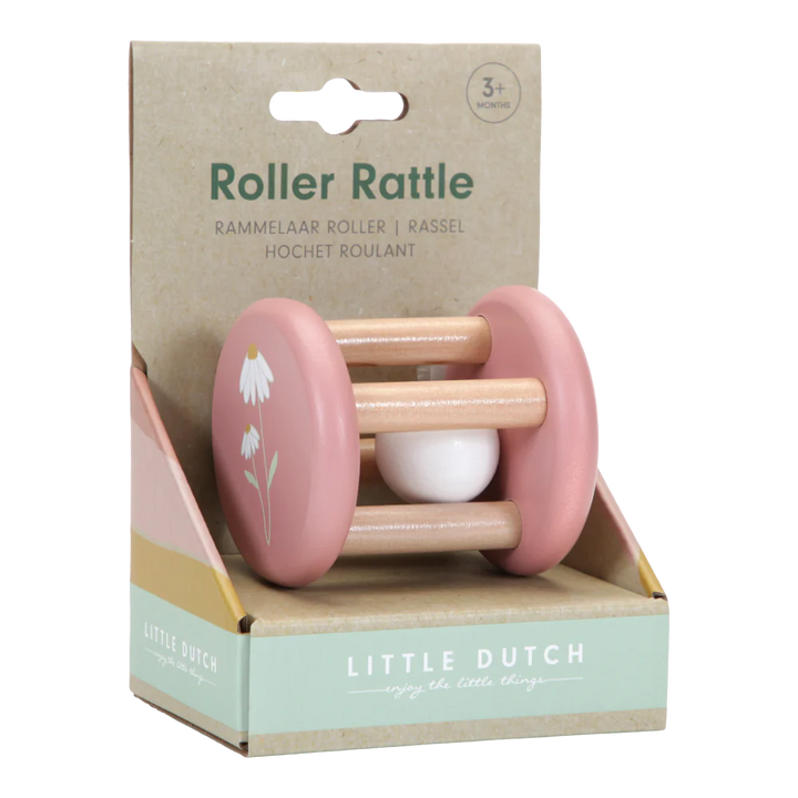 Pink roller rattle with a white daisy on the end