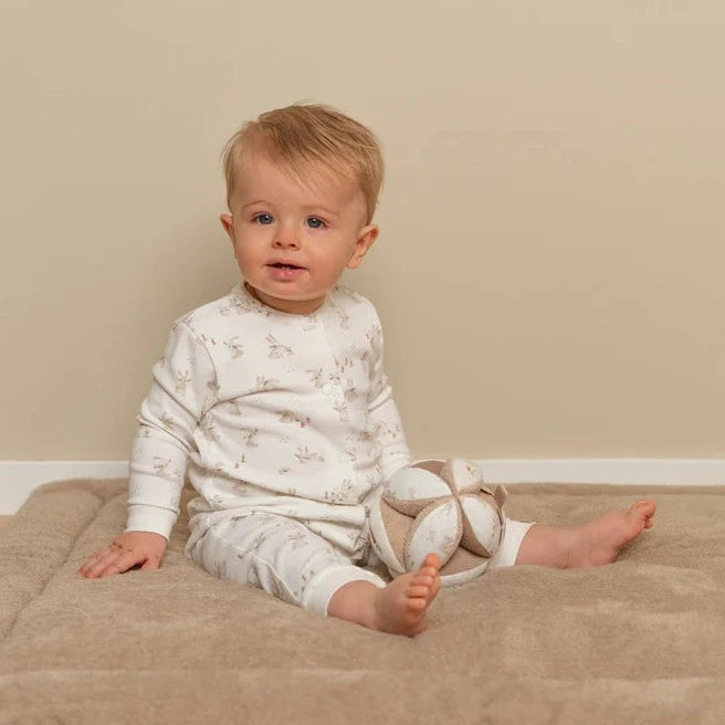 neutral baby sensory ball in soft caramel and white with embroidered bunnies