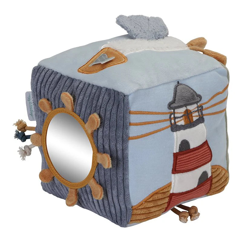 pale blue soft sailor themed activity cube, different activities on each side including a ring, knotty string, mirror
