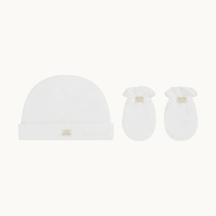 Made from 100% cotton and featuring our signature Angel Wing pointelle design, Marie-Chantal’s Pointelle Cotton Gift Set is a newborn must-have.

- Pointelle Cotton Sleepsuit

- Pointelle Cotton Hat And Mitten Gift Set

- Footed design

- Snap fastenings down the front