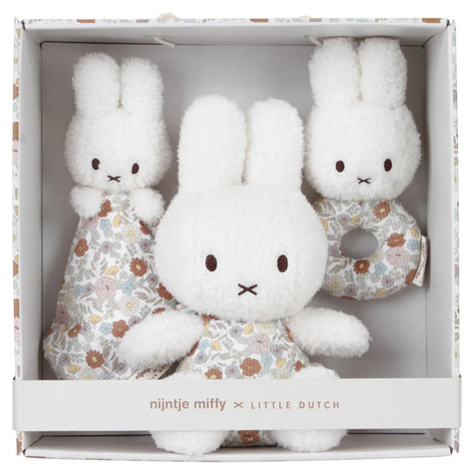 gift box with white miffy plush in floral dress, white Miffy comforter with floral design, white Miffy soft rattle with floral handle in a gift box