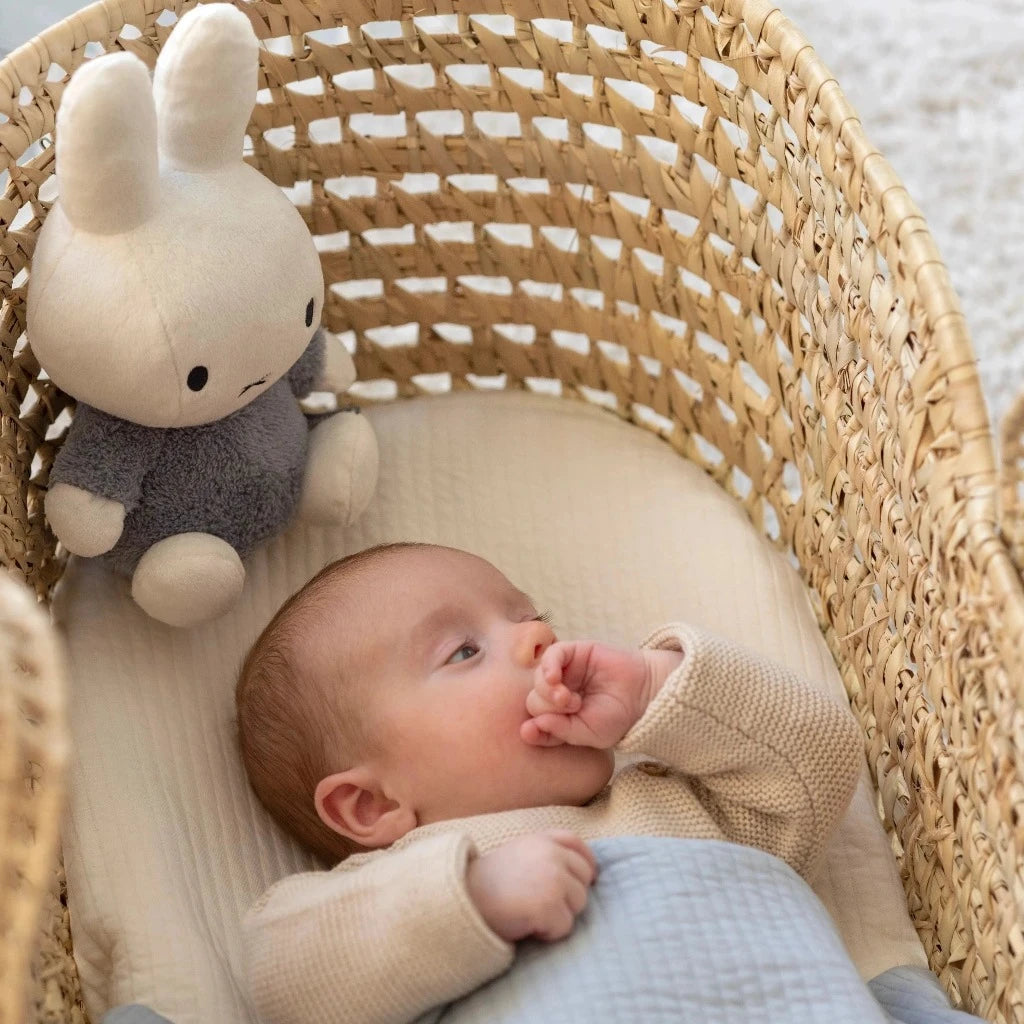 White miffy soft toy with a grey/blue fluffy outfit