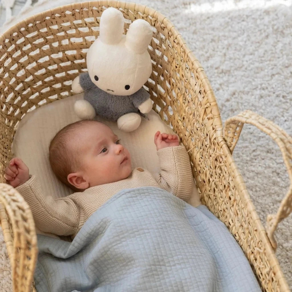 White miffy soft toy with a grey/blue fluffy outfit