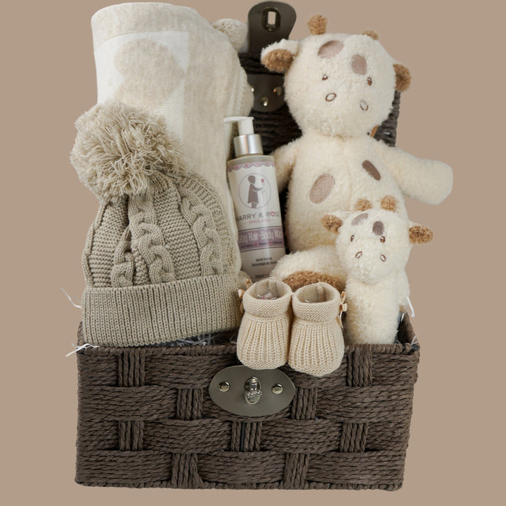 NEUTRAL BABY HAMPER, BABY BLANKET WITH HEARTS AND POMPOMS, BABY WASH, NATTOU GIRAFFE , GRAFFE RATTLE, BABY BOOTIES 