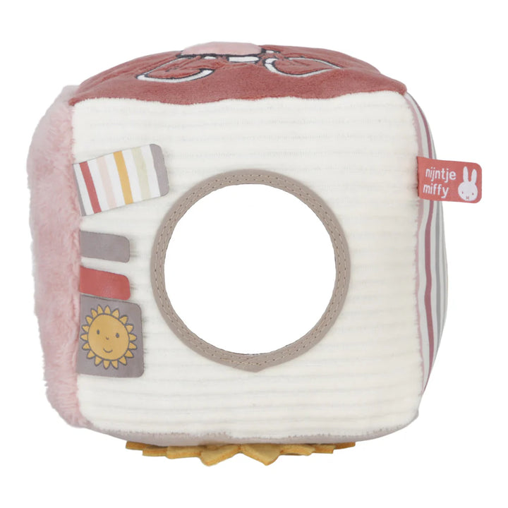 Soft Fluffy Activity Cube Miffy themed in pink with a differebt design on each side, includes a mirror, taggies and pictures of miffy flying a kite and riding a bicycle