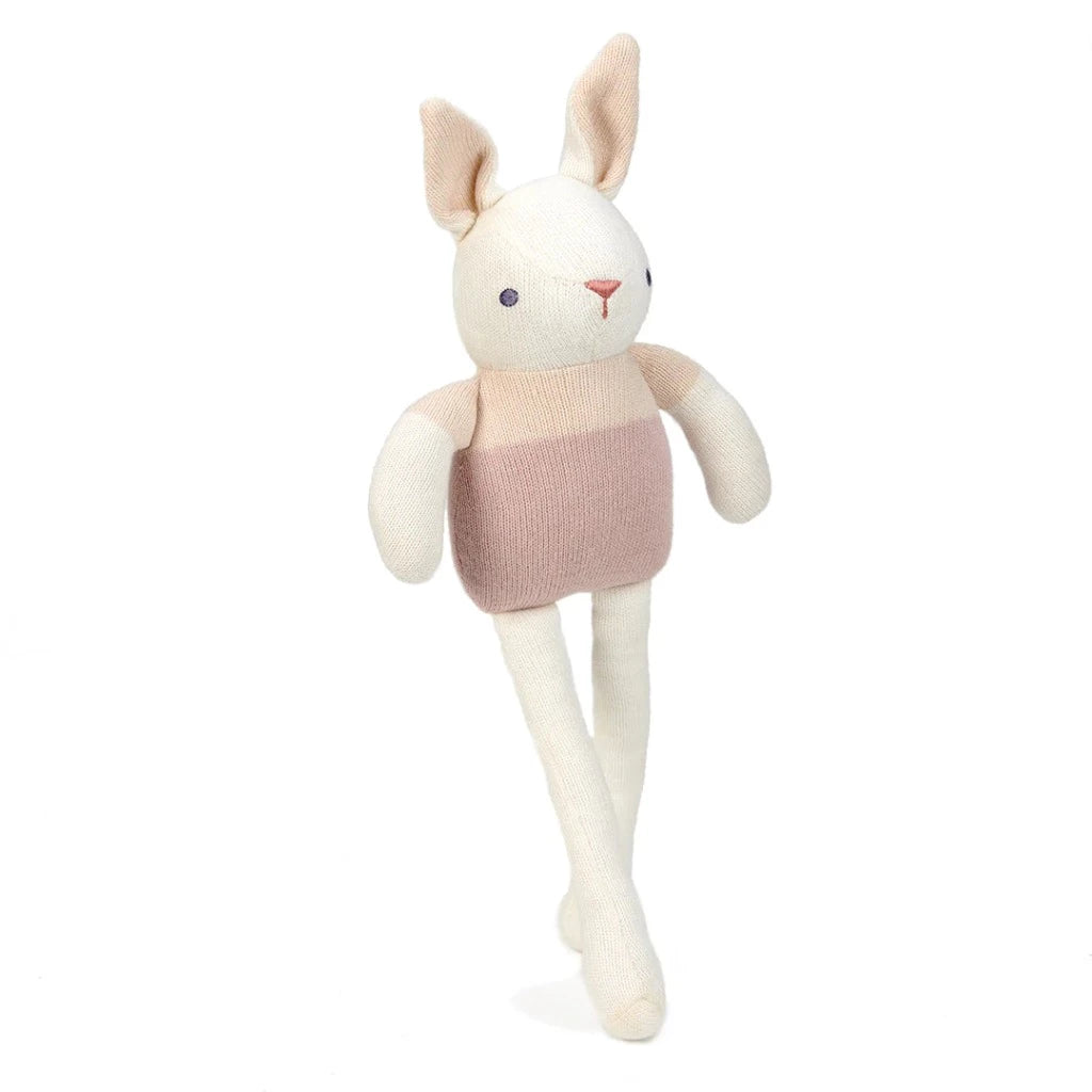 White organic knit bunny in pink outfit 