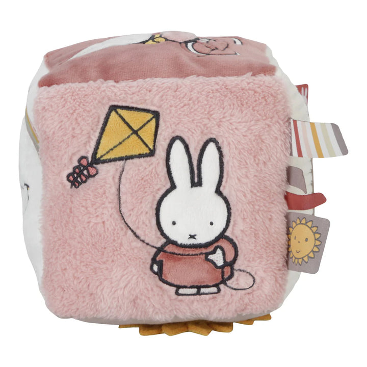 Soft Fluffy Activity Cube Miffy themed in pink with a differebt design on each side, includes a mirror, taggies and pictures of miffy flying a kite and riding a bicycle