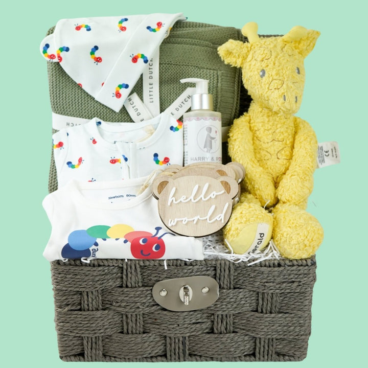 organic baby hamper, sage green organic baby blanket, white baby organic clothing nset with rainbow coloured catterpillars includes baby sleepsuit, baby hat with ears and bodysuit, organic baby wash, wooden baby milestone discs, yellow organic soft giraffe