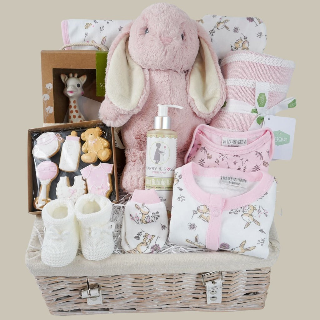 baby girl hamper basket, white layette with pink trim and bunnies, pink eco bunny, baby  themed biscuits in a box, sophie la girafe so pure, baby pink and white striped blanket, baby organic wash