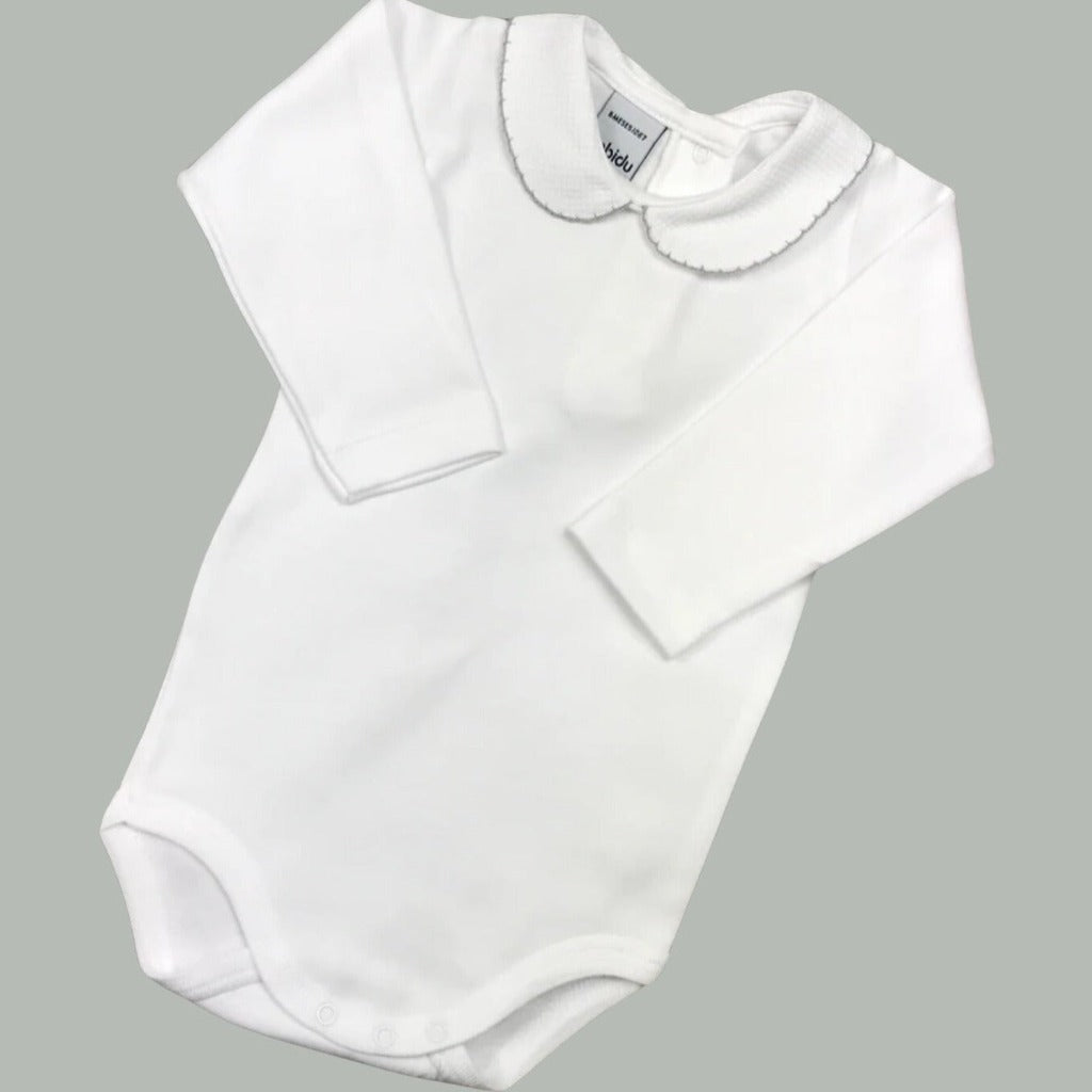 White cotton Spanish baby vert with Peterpan collar and grey picot trim around the collar