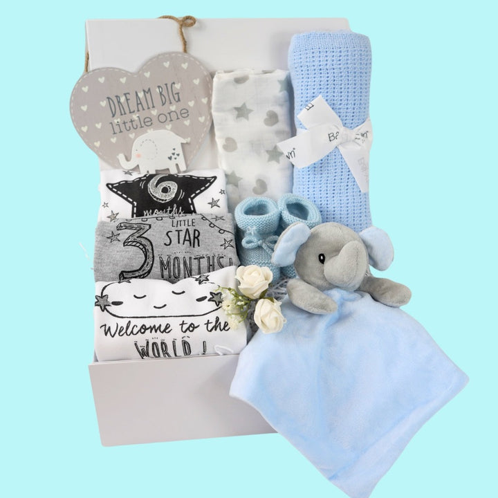 baby boy hamper box includes baby milestone vests, dream big plaque, muslin, cellular blanket, grey and blue elephant comforter, blue baby boy booties