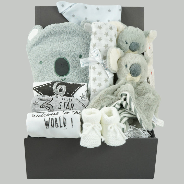 koala themed baby hamper box with koala grey hooded baby towel, white and grey cotton knot hat, white and grey muslin, Koala soft toy, Koala comforter , 2 x cotton white milestone vests newborn , 3 months and 6 months , white knit booties 