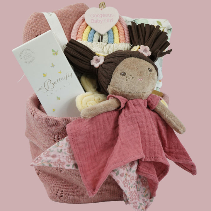 Baby girl knitted hamper basket in pink with matching basket, baby swaddle with butterfly design, Little Butterfly London organic baby bath, fairy baby comforter with brown bunches