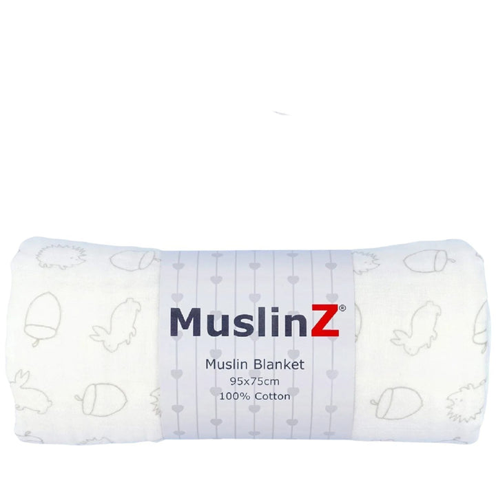 white muslin baby blanket with bunnies and acorns in grey