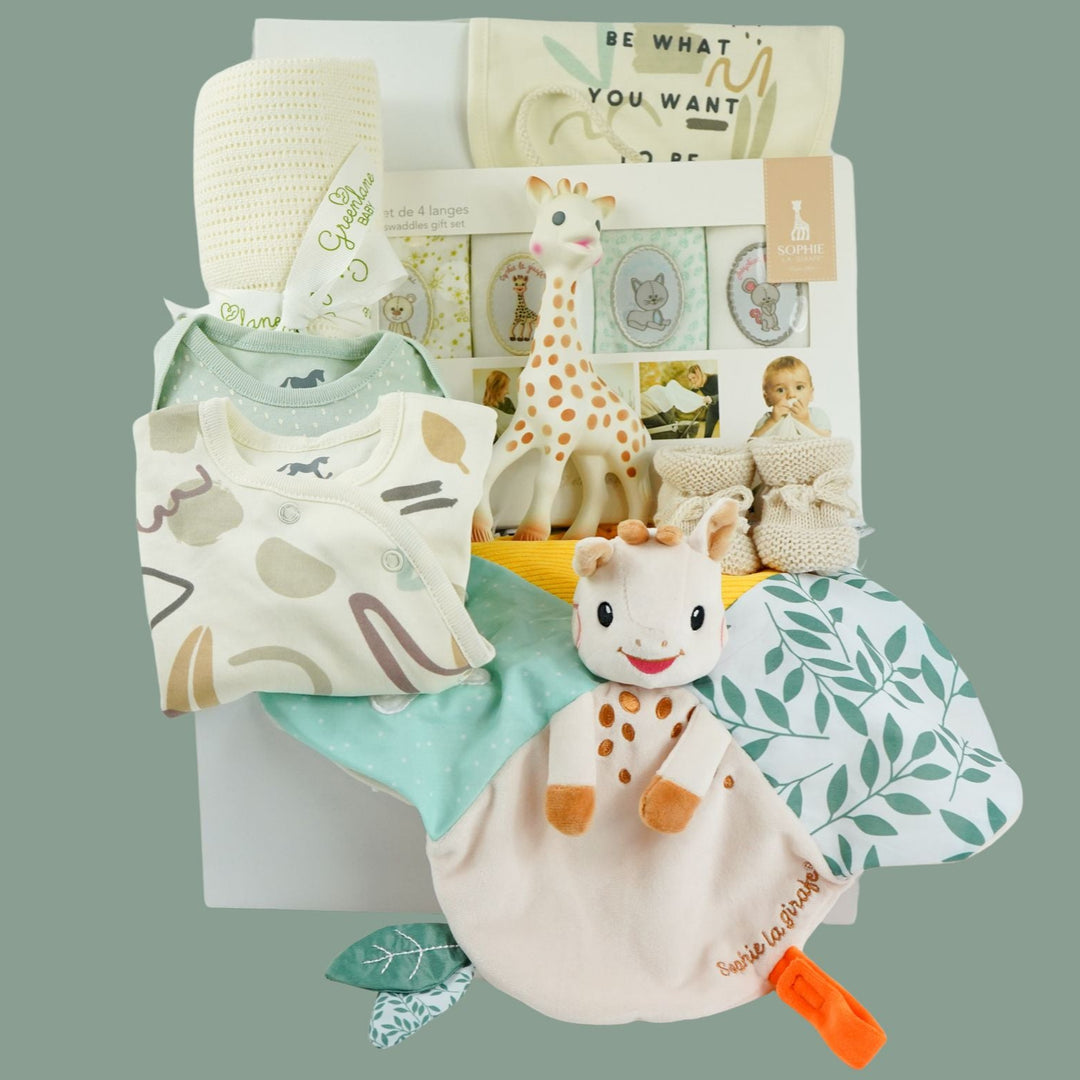 baby hamper basket with sophie la girafe toy, sophie la girafe comforter , sophie la girafe muslins baby clothing set , baby cellular blanket in cream baby booties 
