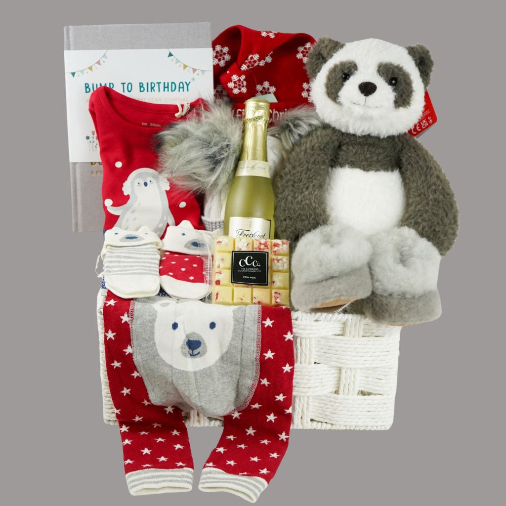 luxury baby hamper , my first Christmas, baby Christmas outfit, baby journal, black and white panda soft toy, white chocolate square,  nnsecco, fluffy hat, alpaca baby slippers 