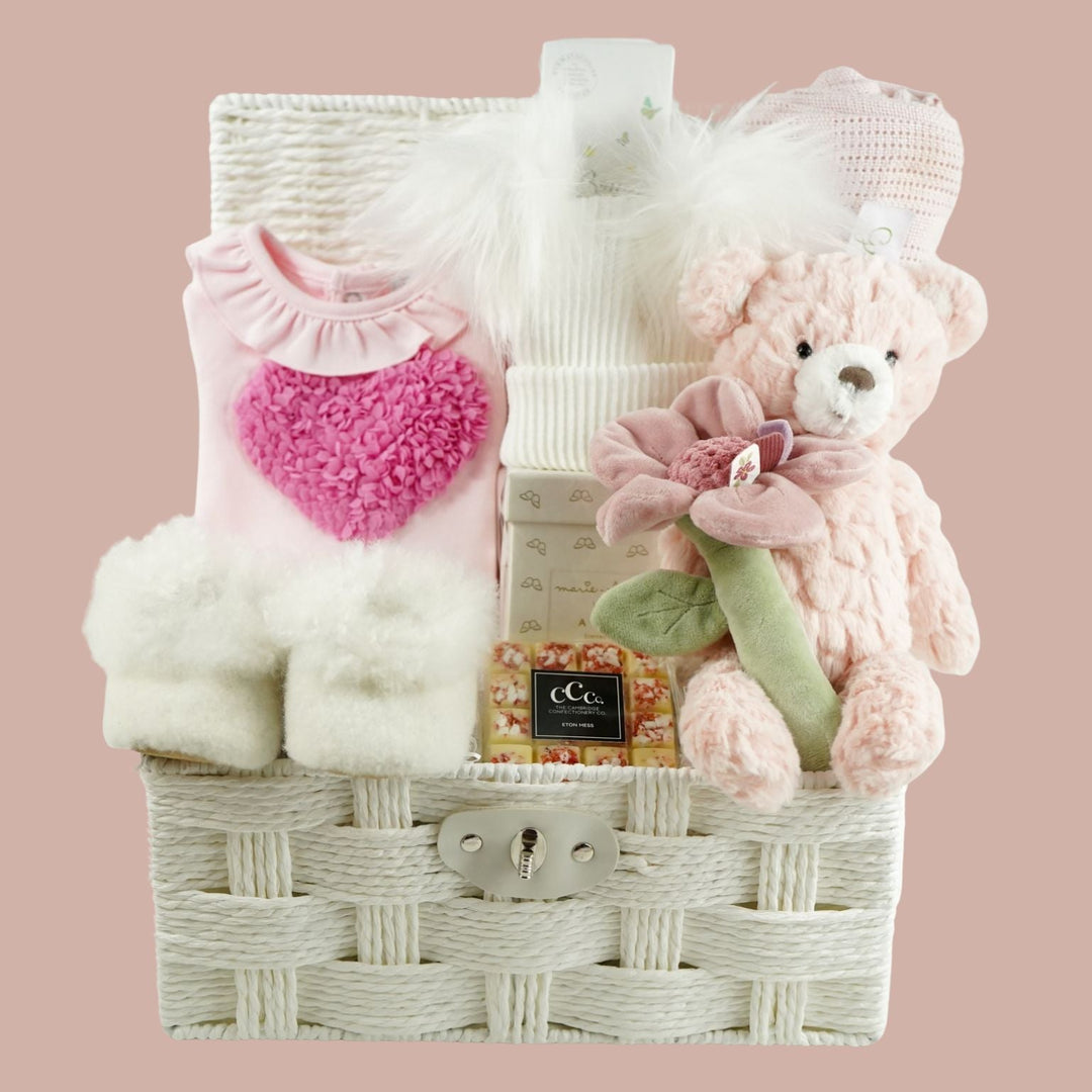 luxury baby girl hamper with baby utfit, hat, toiletries, teddy and chocolate