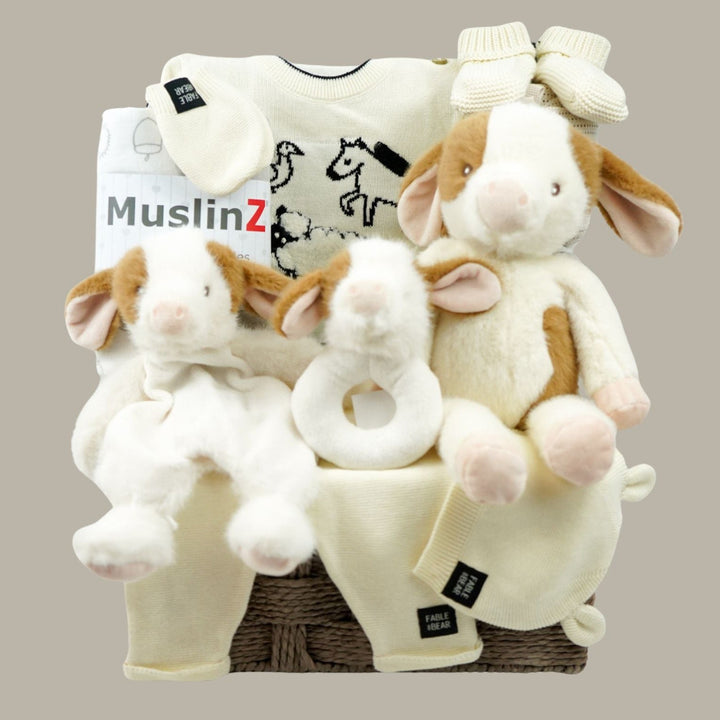 Luxury baby gifts in grey hamper basket  organic baby baby clothing set, soft cow and matching rattle and comforter, muslin swaddles, baby organic booties