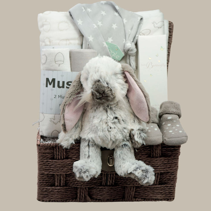neurral baby hamper with bunny, hooded towel, muslins and muslin blanket, baby socks, toiletries and baby socks