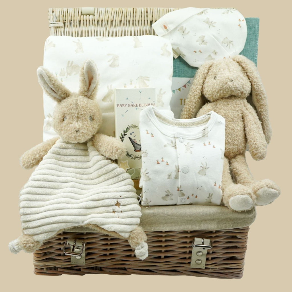 baby gift hamper with bunny comforter and matching bunny soft toy, bunney bassinet blanket, baby bubble bath, baby bunn clothing set with matching hat and journal
