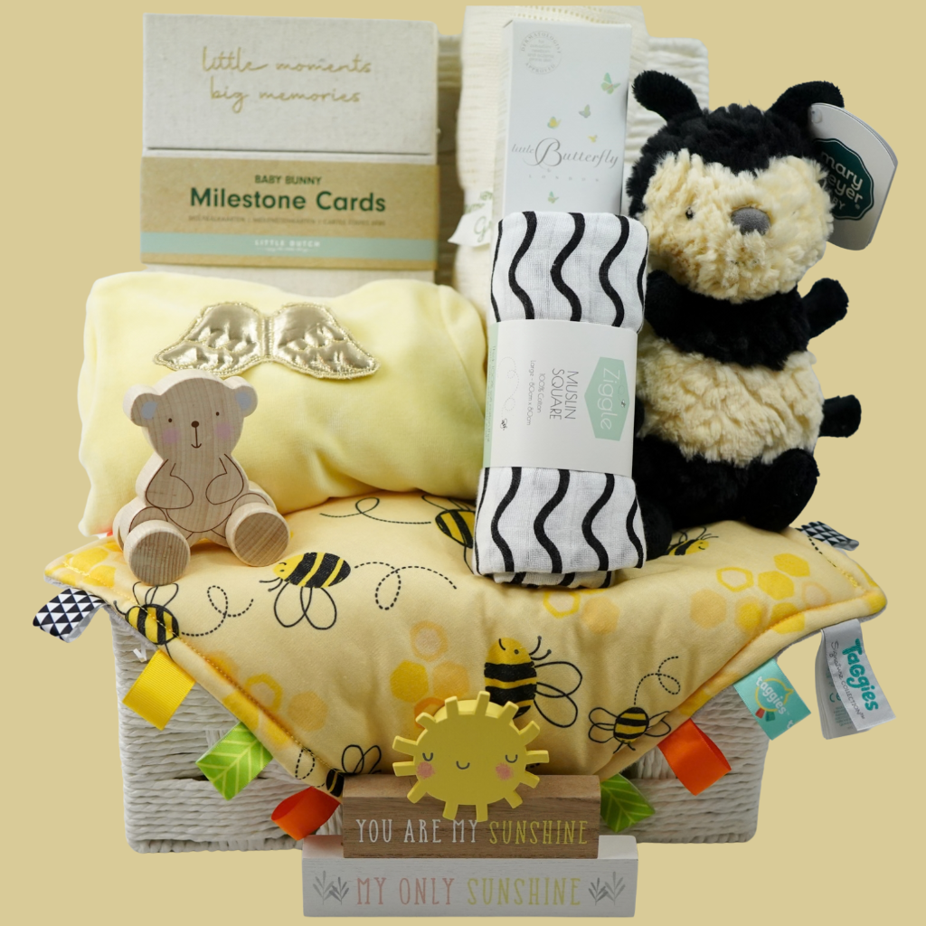 bumble bee themed baby hamper basket with yellow sleepsuit with gold angel wings, milestone cards, sensory muslin, bamboo baby blanket