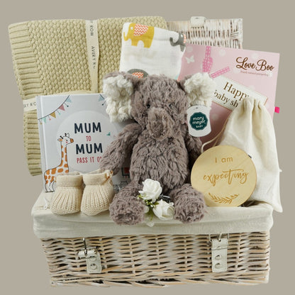 Baby shower gift, neutral hamper with baby blanket, mum to mum gift book, baby booties, mum and baby toiletries, pregnancy wooden milestone gifts, baby muslin swaddle, baby soft elephant toy
