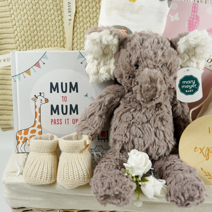 Baby shower gift, neutral hamper with baby blanket, mum to mum gift book, baby booties, mum and baby toiletries, pregnancy wooden milestone gifts, baby muslin swaddle, baby soft elephant toy